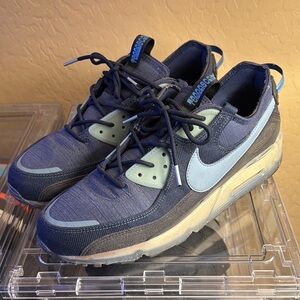 Nike Blue Sneakers with Prominent Swoosh and Sporty Design